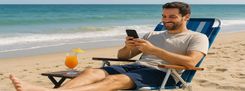 Taking care of business while on vacation. Guy on mobile phone, smiling